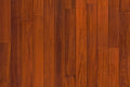 Garrison Exotics Santos Mahogany 5-inch engineered hardwood plank, smooth finish, beveled edge, dark tone with bold grain.