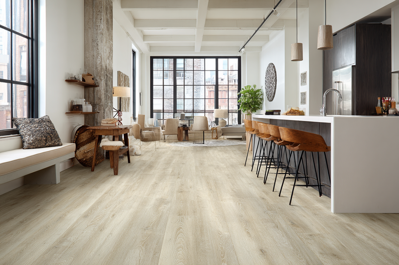 Wide-plank luxury vinyl flooring in a modern open-concept loft