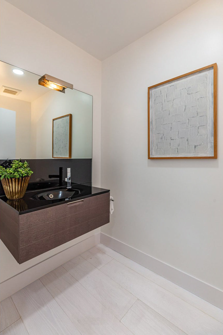 Room scene featuring Garrison Gold Label White Lotus wide-plank engineered hardwood flooring in a bright open living space