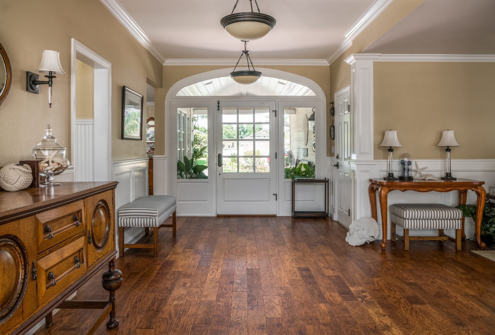 Room scene with Garrison Carolina Classic Salem hand-distressed Hickory engineered hardwood flooring in a warm transitional interior