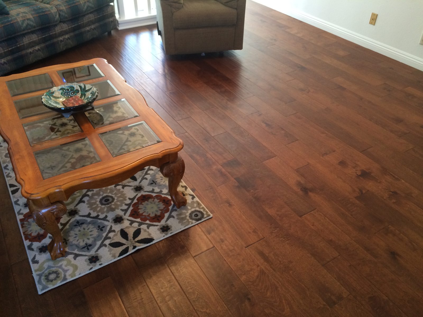 Room scene with Garrison Competition Buster Chestnut dark distressed engineered hardwood flooring installed throughout