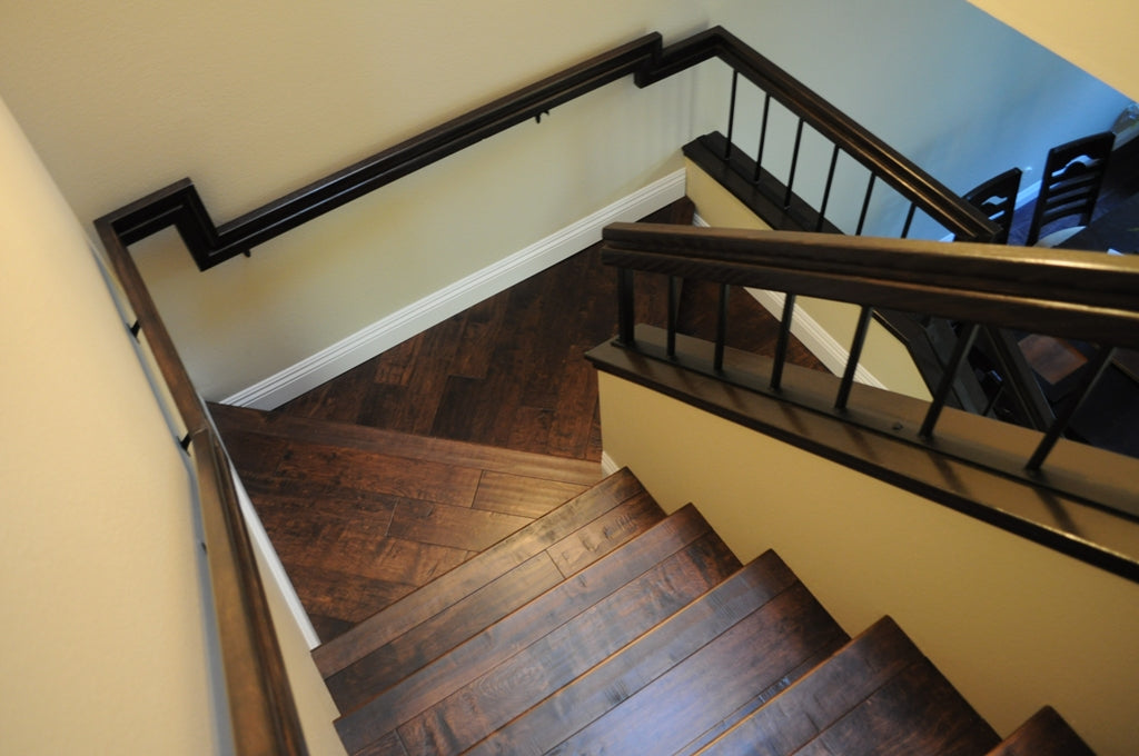 Room scene with Garrison Competition Buster Truffle distressed birch engineered hardwood flooring in a transitional living space