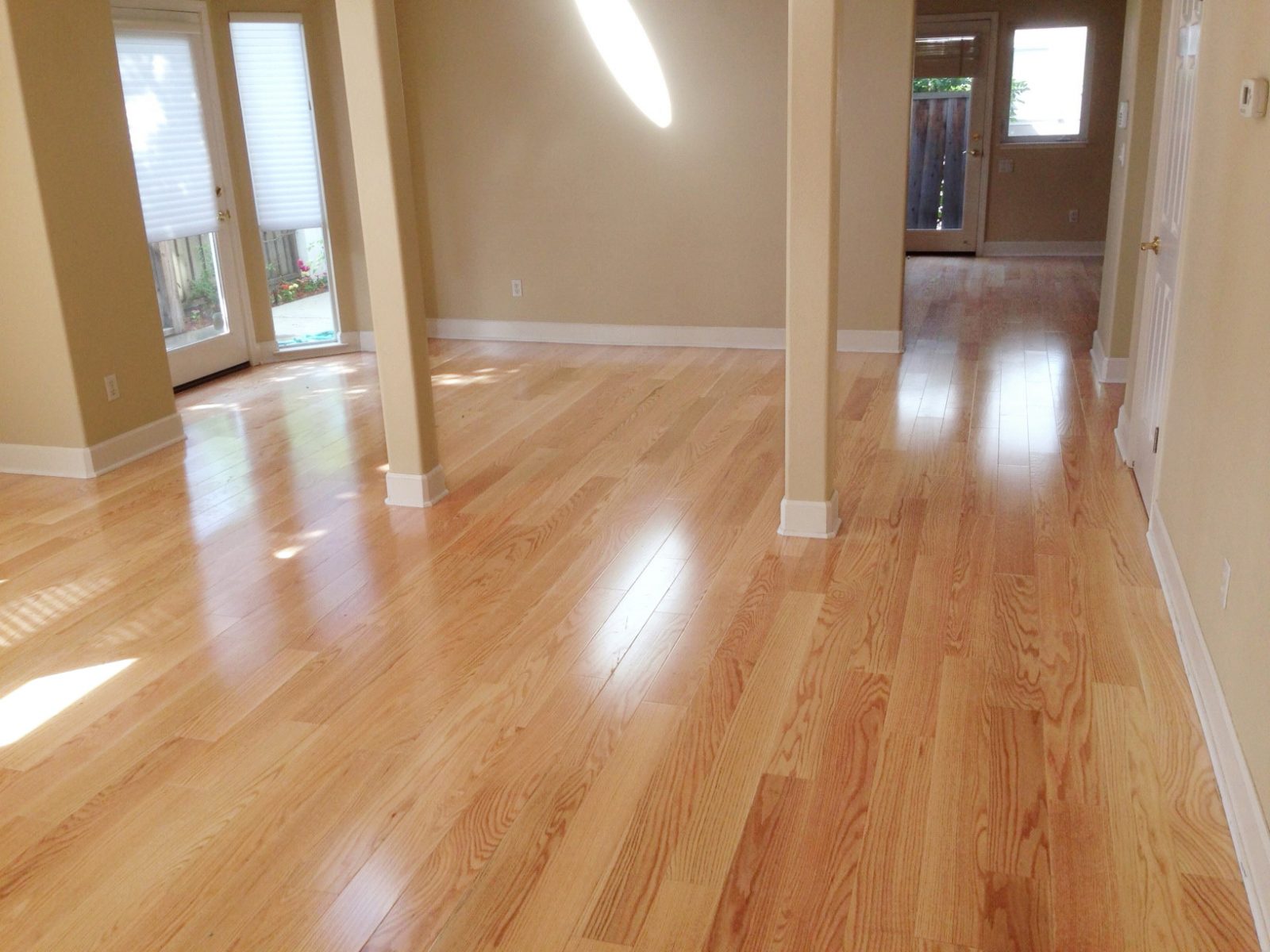 Room scene with Garrison Crystal Valley America Red Oak Natural engineered hardwood flooring in a transitional living space