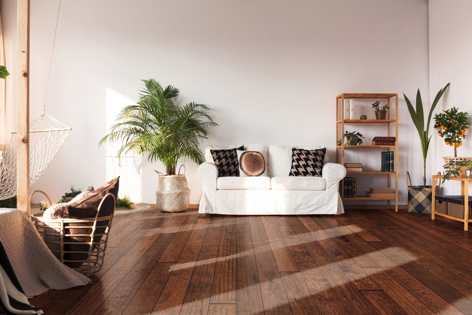 Room scene featuring Garrison Competition Buster Spice hand-distressed Birch engineered hardwood flooring in a warm residential interior.