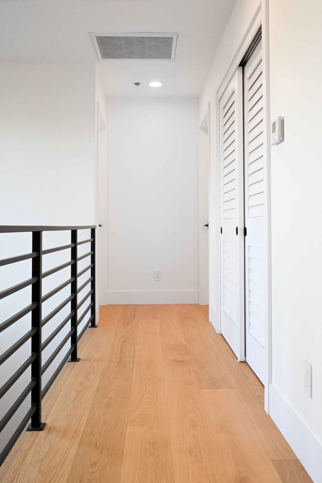 Allora Strada Select European Oak engineered hardwood flooring installed in an open-plan living space.