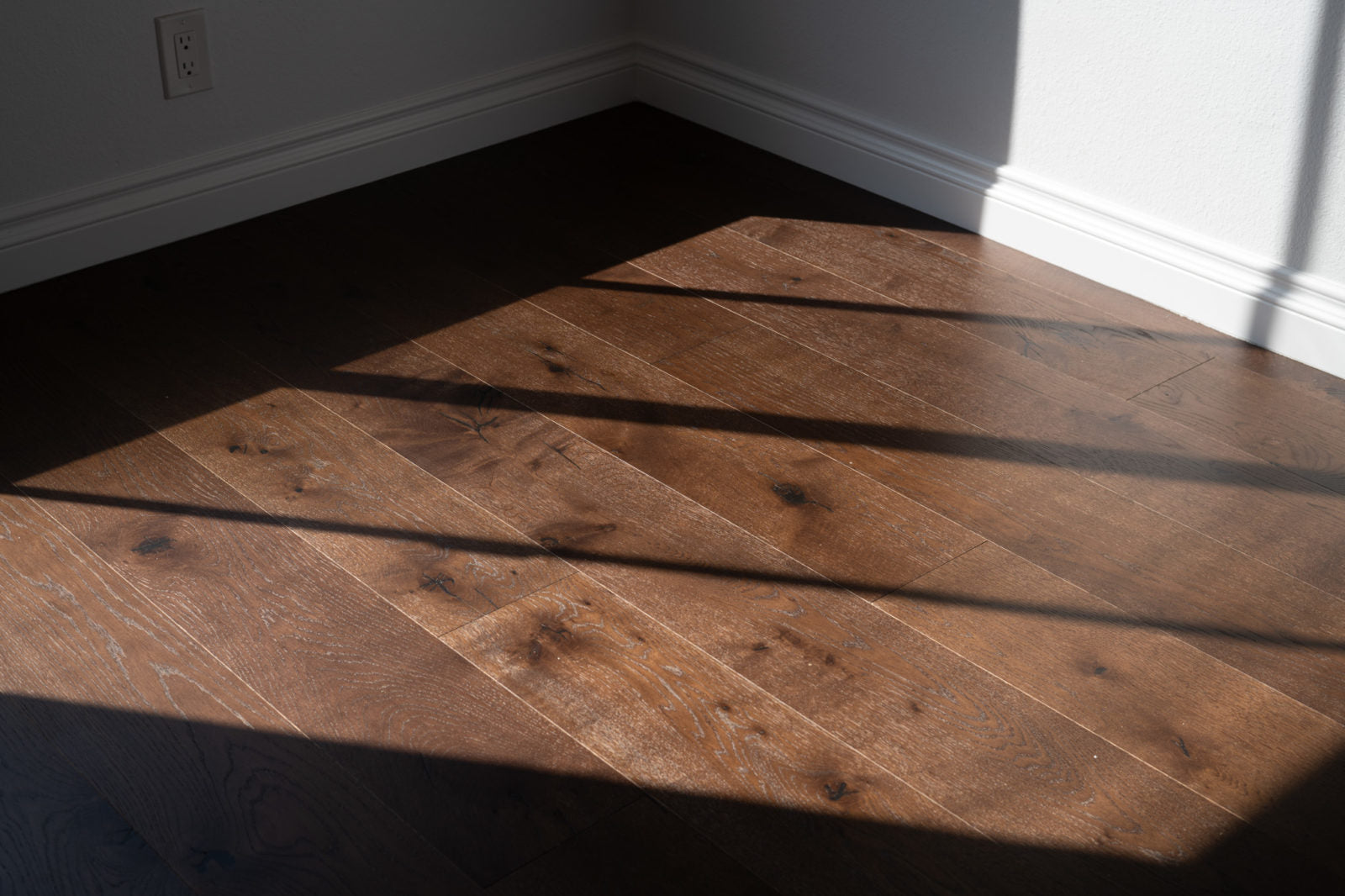 Living room floored in Allora Ventasso dark brown European Oak engineered hardwood plank flooring