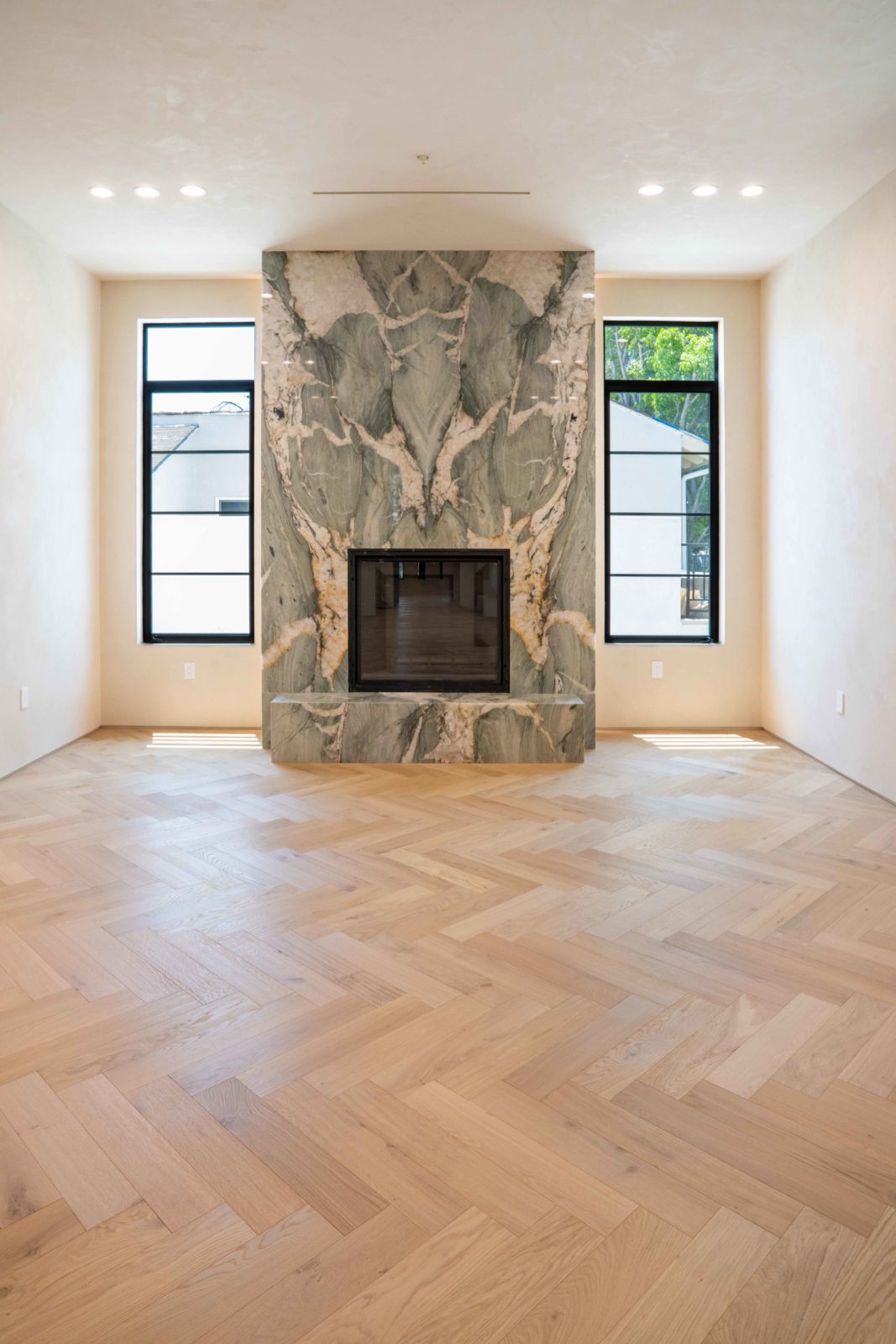 Allora Sella Herringbone European Oak flooring laid in herringbone pattern in a living room setting.