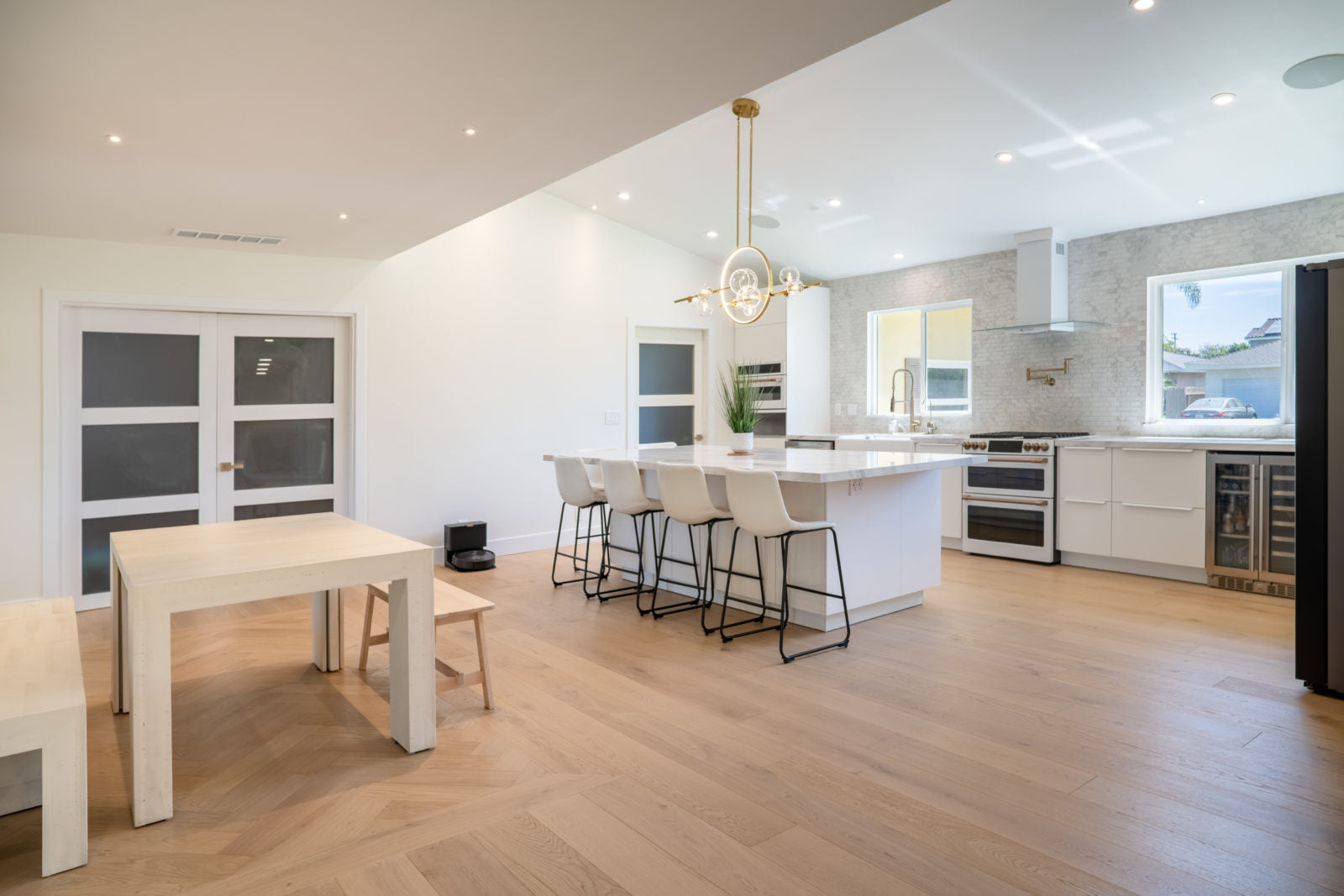 Living room floor featuring Allora Doma Herringbone engineered European Oak flooring in a herringbone pattern.