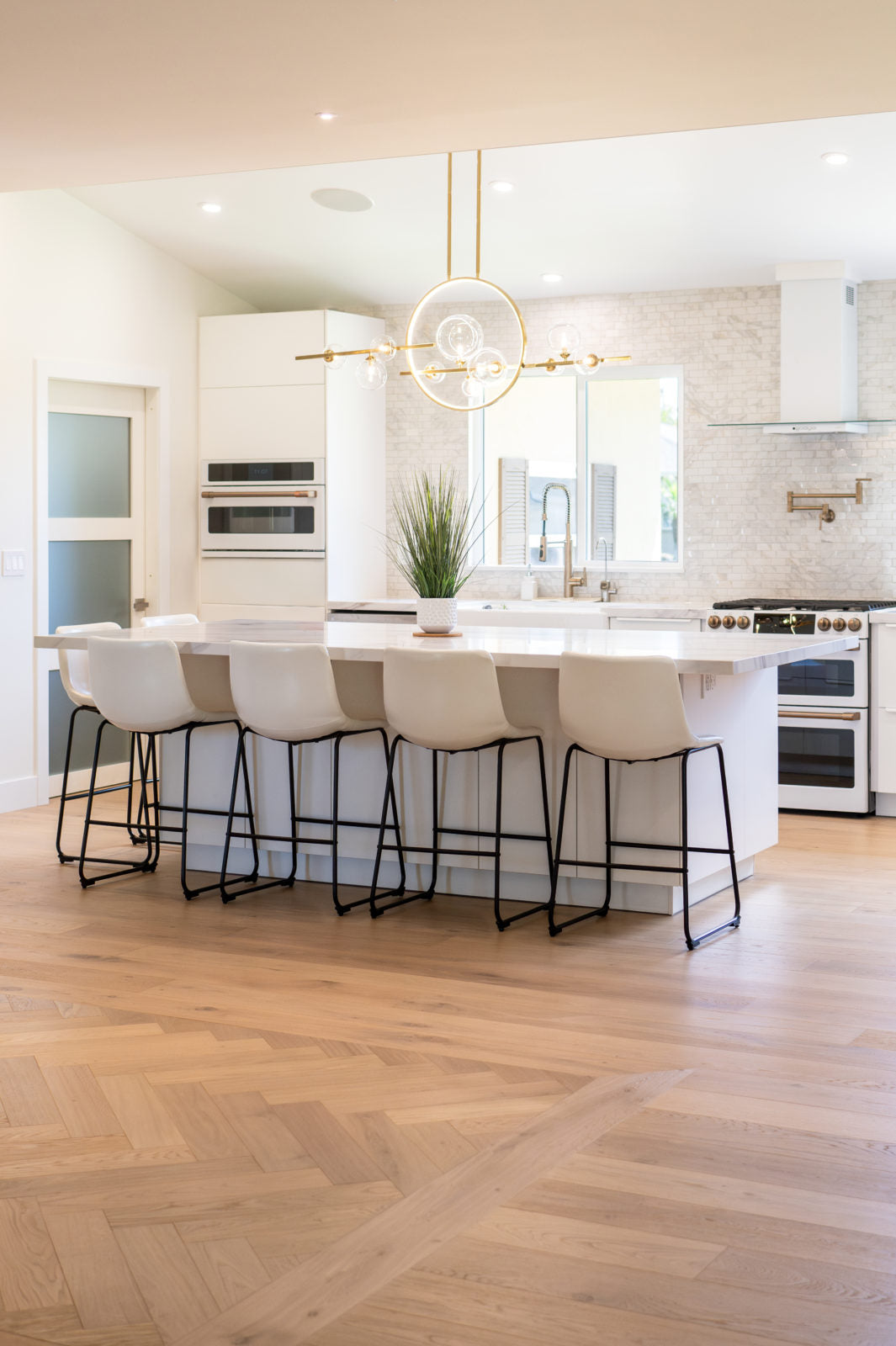 Living room floor featuring Allora Doma Herringbone engineered European Oak flooring in a herringbone pattern.