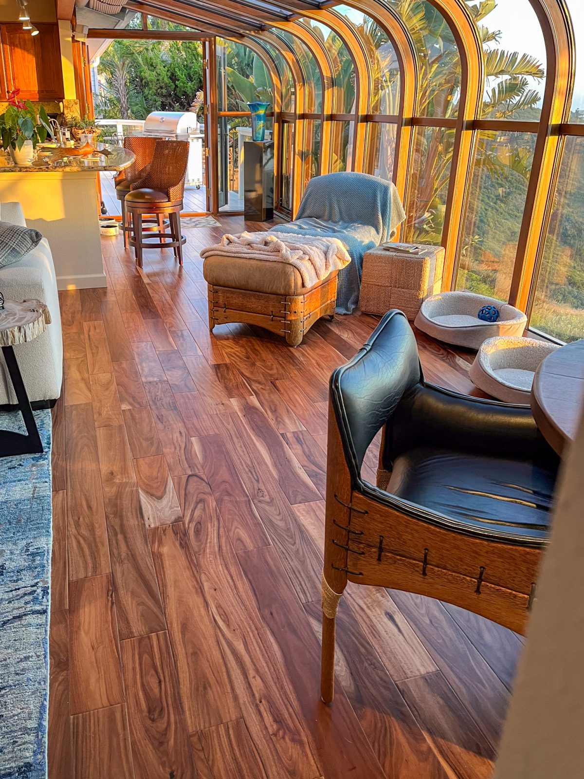 Room scene with Garrison Exotics Natural Acacia engineered hardwood flooring in a warm interior setting