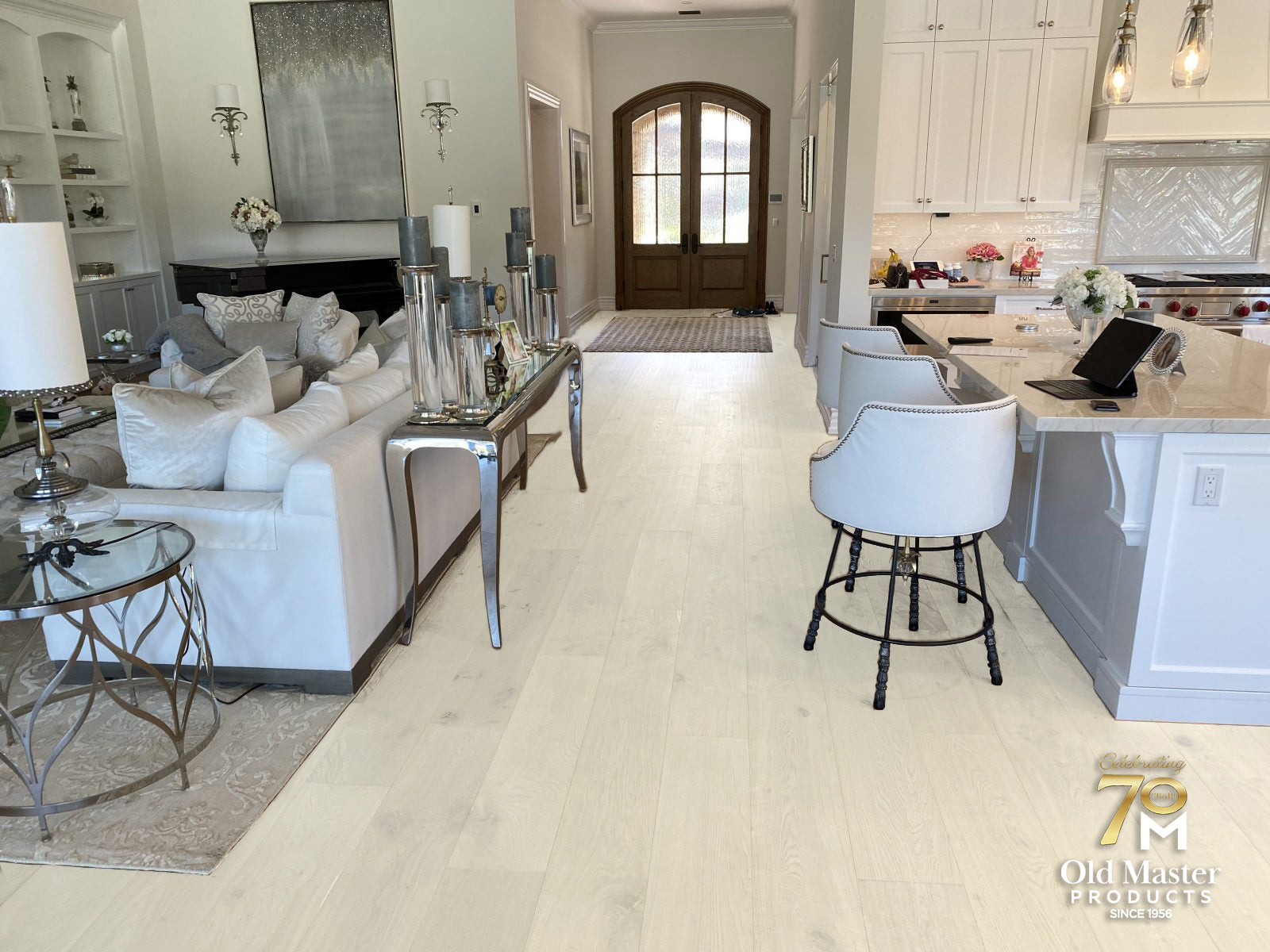 Room scene featuring Garrison Legends Brescia engineered hardwood in cool gray tone across an open-plan living space