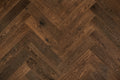Garrison Legends Caffe Herringbone engineered oak plank, deep espresso tone with wire-brush texture and micro-beveled edge