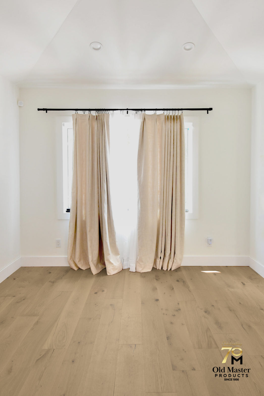 Room scene featuring Garrison Legends Chantal wide-plank European Oak engineered hardwood in warm beige tone