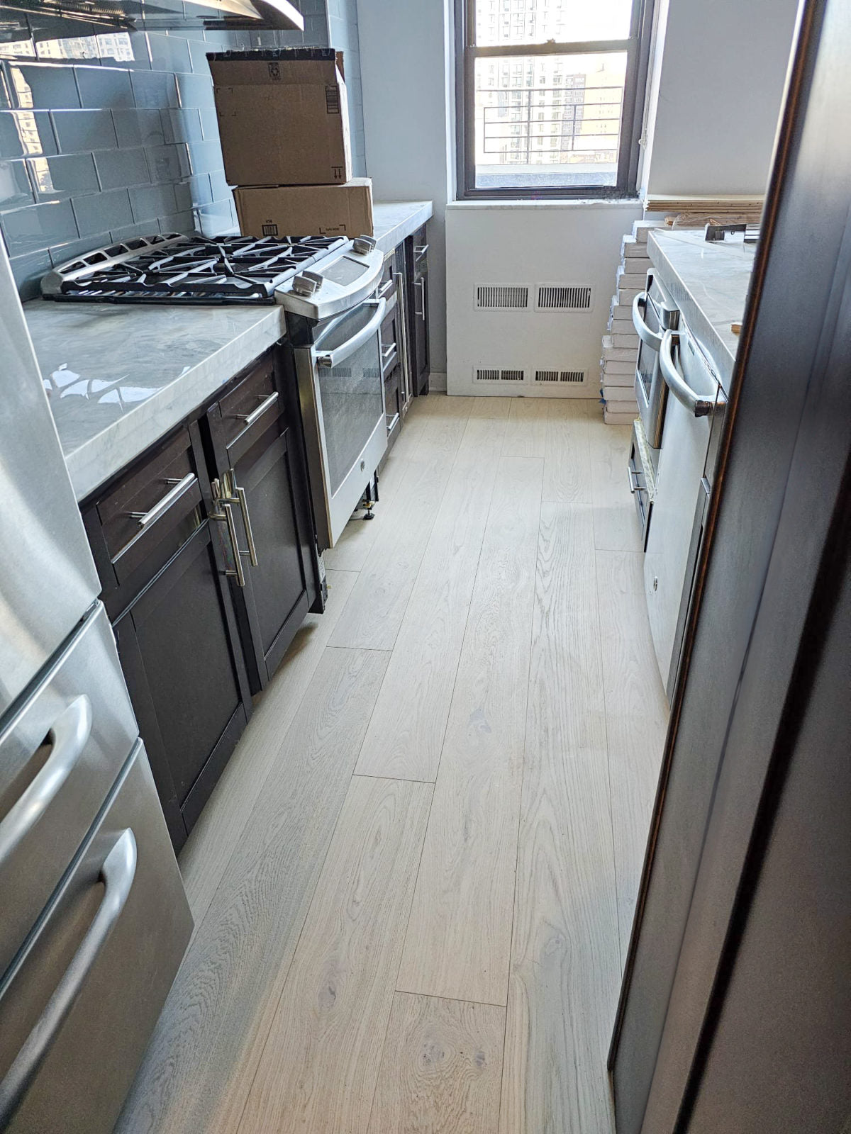 Allora Luna European Oak engineered hardwood flooring installed in a bright, open-plan living room