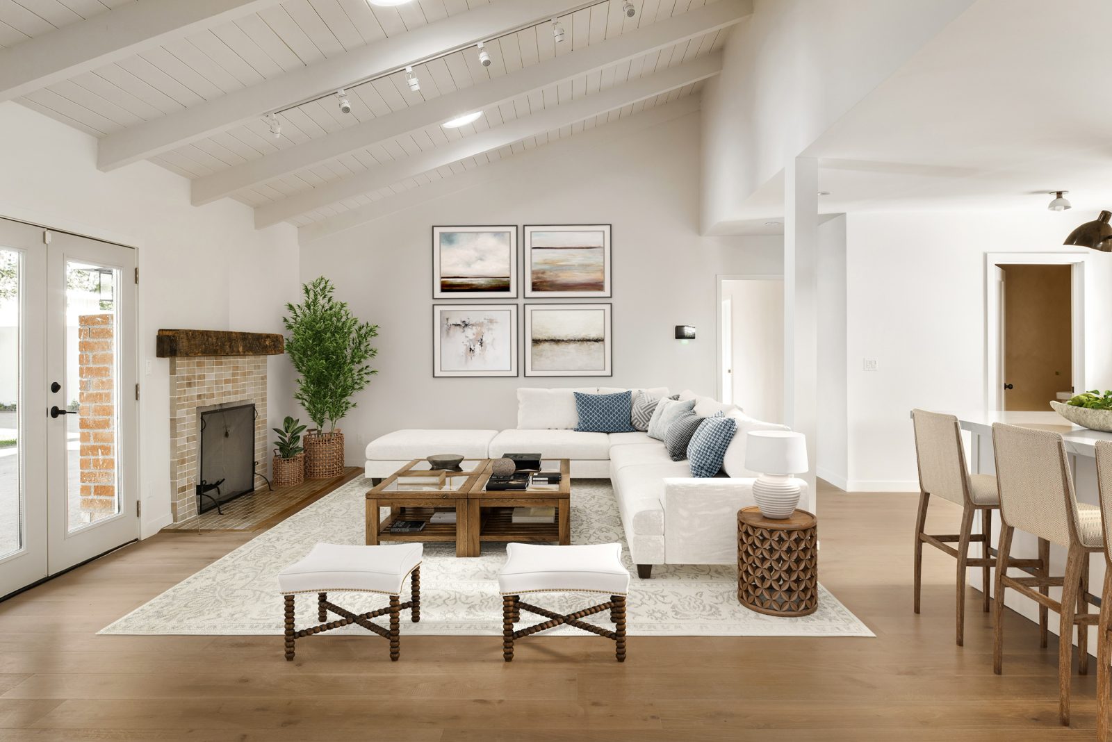 Room scene with Garrison Private Selection Gobi wide-plank European Oak engineered hardwood flooring in a warm, natural medium tone.