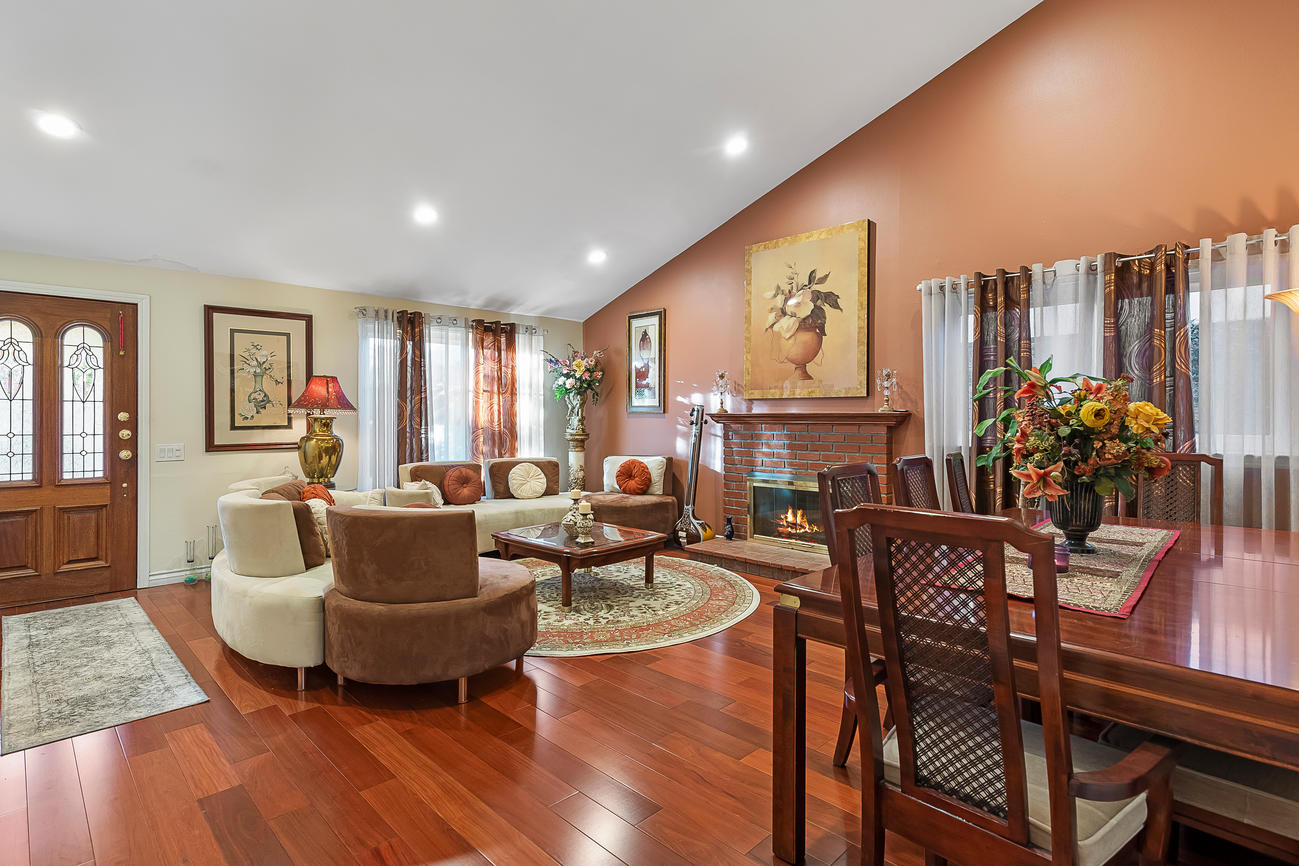 Room scene with Garrison Exotics Santos Mahogany dark-toned engineered hardwood flooring in a modern living space.