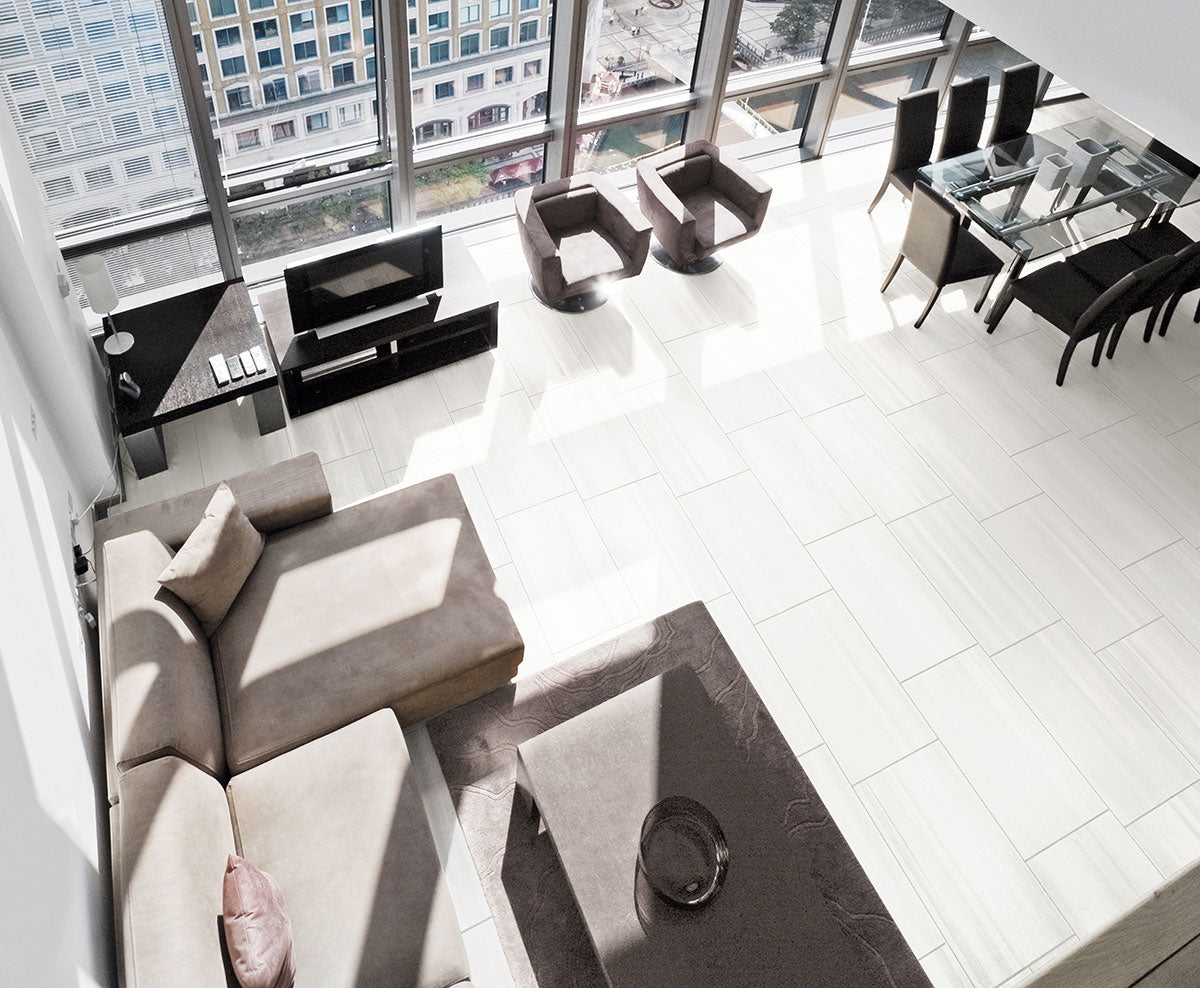 MSI Watercolor Bianco — surface detail in natural tonality through-bodied porcelain for full-room install