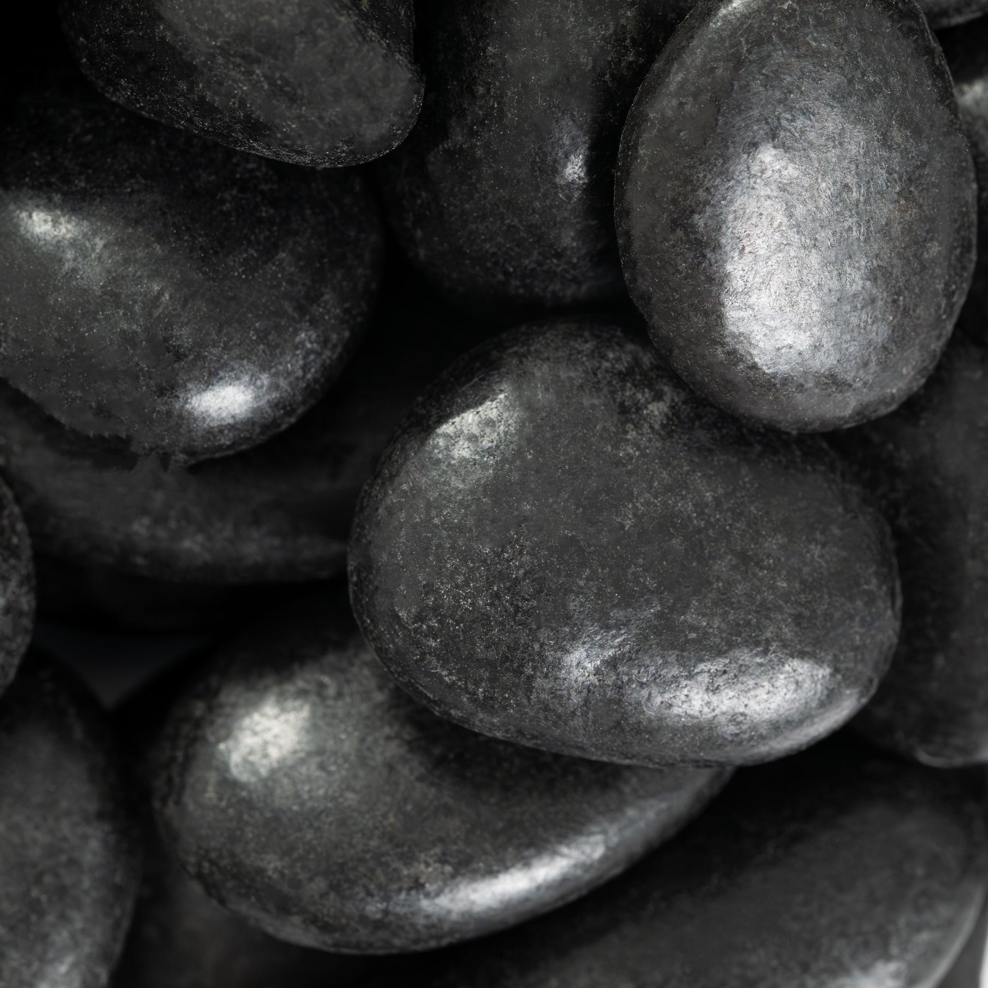 MSI Black Polished Pebbles — surface detail in black tonality