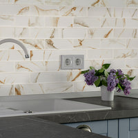MSI Calacatta Gold Matte 2x6 Subway Tile — surface detail in gold tonality