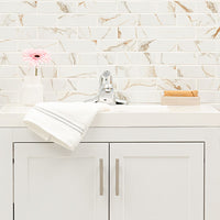 MSI Calacatta Gold Matte 2x6 Subway Tile — surface detail in gold tonality