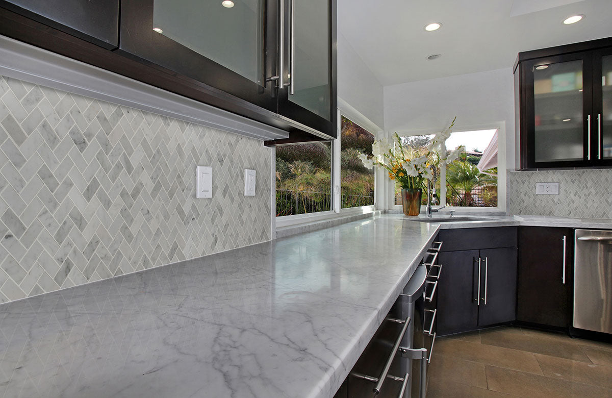 MSI Carrara White 1x2 Herringbone Tile — surface detail in white tonality