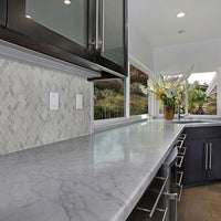 MSI Carrara White 1x2 Herringbone Tile — surface detail in white tonality