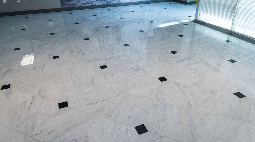 MSI Carrara White — surface detail in white tonality quarried heritage stone slab for residential install