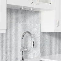 MSI Carrara White Milano Ribbon 12x24 Honed — surface detail in white tonality
