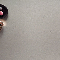 MSI Fossil Gray Quartz — surface detail in gray tonality factory-finished eased edge ready for install