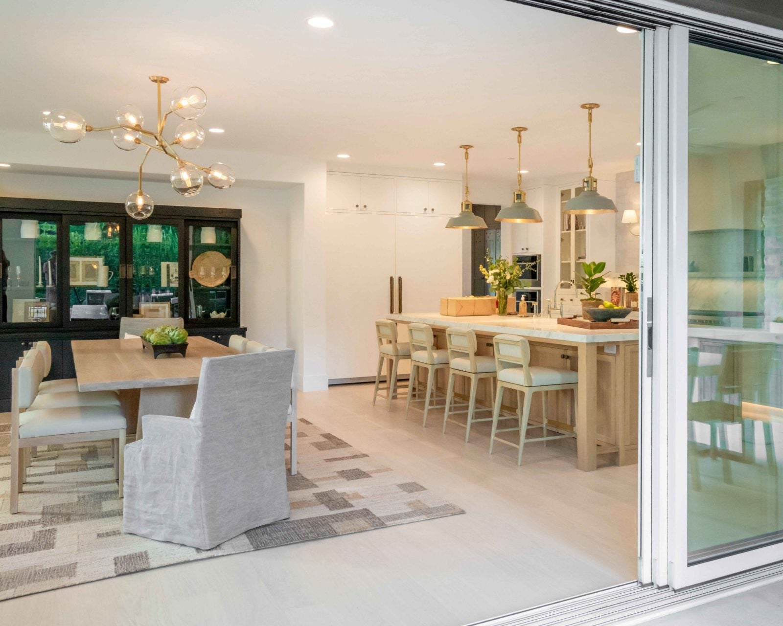 Allora Luna Select European Oak engineered hardwood flooring installed in a bright, open living room