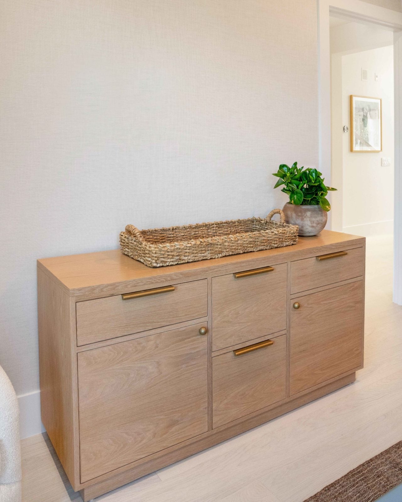 Allora Luna Select European Oak engineered hardwood flooring installed in a bright, open living room