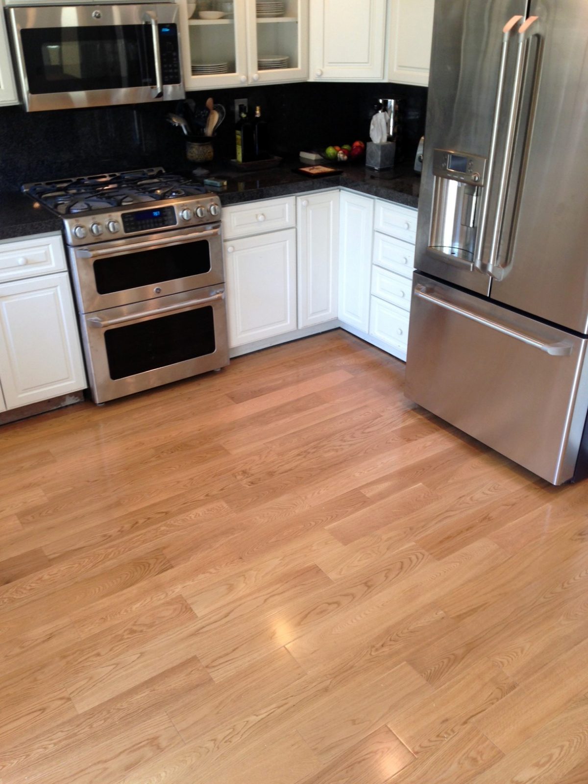 Room scene featuring Garrison Crystal Valley White Oak Natural engineered hardwood flooring in a light contemporary interior